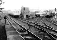 37037 held at Slateford junction in May 1981 while DMU 101306 prepares to call at Slateford station with an Edinburgh Waverley - Glasgow Central (via Shotts) stopping train .<br><br>[John Furnevel 20/05/1981]