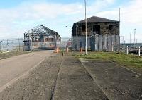 The end of the pier at Granton Harbour in April 2002 with rails remaining along its length. The building on the right dates from 1842 and was originally built as a gunpowder store. <br><br>[John Furnevel 27/04/2002]