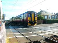 Westbound Edinburgh - Glasgow Central train on Kingsknowe level crossing, October 2002.<br><br>[John Furnevel 07/10/2002]