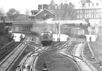 A northbound service leaving Dumfries for Glasgow in 1971. Note the Type 2s stabled in the former Kirkcudbright and Stranraer bays on the right. For a painting based on this photograph [see image 22888]. <br><br>[John Furnevel 08/04/1971]