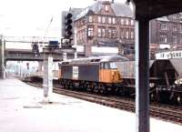 Loadhaul liveried 56107 passes north through Carlisle with coal empties on 11 August 1997.<br><br>[John Furnevel 11/08/1997]