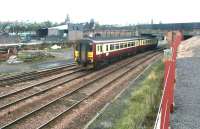 A Carlisle shuttle approaching Dumfries on 13 September 2003 runs past the south sidings.<br><br>[John Furnevel 13/09/2003]