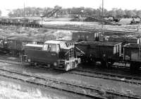 An NCB Sentinel diesel shunter (4WDH 10012/1959) on duty in the yard at Killoch in March 1972. This locomotive is now preserved at the ARPG centre, Waterside. [See image 28387]<br><br>[John Furnevel 04/03/1972]