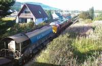 A pair of class 37s with a ballast train heading north away from Aviemore in September 2004.<br><br>[John Furnevel 13/09/2004]