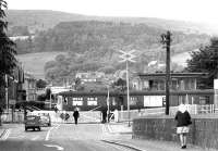 Looking west along the A811 Balloch Road on 28 June 1971 as a class AM3 electric leaves Balloch Central station via the level crossing on a service to Airdrie.<br><br>[John Furnevel 28/06/1971]