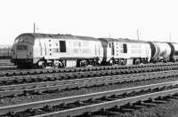 NBL Type 2s 6121+6124 eastbound through Cadder yard with an oil train in 1971. Both locomotives were withdrawn from Eastfield shed in October of that year.<br><br>[John Furnevel 17/08/1971]