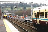 Work in progress on the new platform at the north end of Anniesland Station for the Maryhill line. Scene on 14 February 2005, looking between SPT services for Airdrie and Balloch.<br><br>[John Furnevel 14/02/2005]