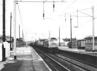 A class 47 southbound through Coatbridge Central in August 1981. The train is the 10.18 Perth - Motherwell with vans attached destined for Manchester.<br><br>[John Furnevel 24/08/1981]