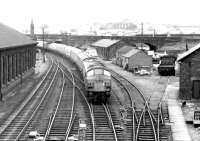 Approaching the Dumfries stop in October 1972 is the morning Leeds - Glasgow Central train, with the usual 'Peak' type 4 locomotive in charge.<br><br>[John Furnevel 15/10/1972]