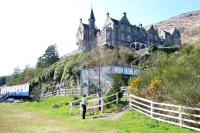 Loch Awe Station and Hotel (with its slightly Transylvanian aura) from the north shore of the loch in April 2005. Note the <i>Tea Train</i> coach to the west of the station.<br><br>[John Furnevel 15/04/2005]