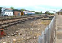 A ScotRail 158 leaving Aviemore for Inverness in May 2002. The train is passing between Aviemore signal box and the Strathspey Railway Society station, used prior to access being obtained to the main Aviemore Station.<br><br>[John Furnevel 10/05/2002]