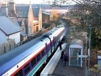 Supervision of passengers leaving via <I>the designated door</I> of an Inverness - Wick service during the stop at the Beauly mini-platform in November 2003. <br><br>[John Furnevel 23/11/2003]