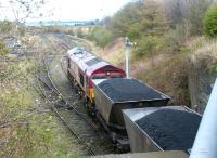 A coal train recently arrived at Cockenzie sidings in April 2002. The Firth of Forth is in the background.<br><br>[John Furnevel 12/04/2002]