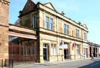 The 1858 Helensburgh Central station seen from Princes Street on 23 April 2005. The west end of the station roof with its magnificent fanlight can just be seen through the alley on the left. [See image 25511]<br><br>[John Furnevel 23/04/2005]