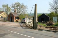 The level crossing and gatekeepers accommodation at the bottom of Station Road, Witton-le-Wear, on the Weardale Railway. Note the groundframe to the right of the crossing. View is south east towards Bishop Auckland in May 2006. No trace remains of the station, which stood on the far side of the crossing and closed in 1965.    <br><br>[John Furnevel 08/05/2006]