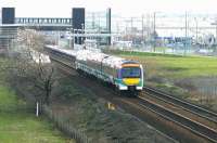 A Glasgow - Edinburgh shuttle about to run through Edinburgh Park station in December 2004.<br><br>[John Furnevel 08/12/2004]