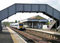 A northbound train calls at Dalmeny in April 2005. ScotRail Unit 170454 is 'between liveries'.<br><br>[John Furnevel 30/04/2005]