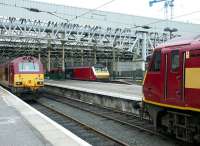 General view across the platforms at the east end of Waverley on 19 July 2004. Standing between the two stabled Sleeper locomotives is DVT 82120, about to leave with a train for North Berwick.<br><br>[John Furnevel 19/07/2004]