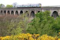 A Glasgow - Edinburgh shuttle approaching Linlithgow on the Avon viaduct  in 2005.<br><br>[John Furnevel 30/05/2005]