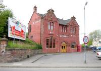 Coatbridge Central photographed in May 2005 following conversion to a pub/restaurant. The Caledonian crest remains on the building frontage above the upstairs window. [See image 20176]<br><br>[John Furnevel 09/05/2005]