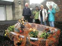 One of the attractive plant arrangements now on display at Largs, with some of those involved in its creation - see <I>'Plants and Poetry at Largs station'</I>.<br><br>[John Yellowlees 27/07/2012]