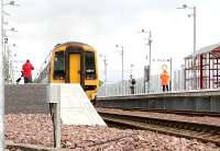 Trying to avoid the b*!!#* photographers - Gartcosh - first day of service at the new station, 9 May 2005.<br><br>[John Furnevel 09/05/2005]