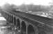 A thoroughly miserable wet Thursday afternoon on the west side of Edinburgh in 1971 as a railcar crosses Slateford Viaduct. Even the bus on Inglis Green Road looks fed up.<br><br>[John Furnevel 11/11/1971]