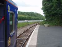 The sharp curves of the Looe branch, part built along an old canal, start immediately as seen in this view northwards from the short Looe platform. 153363 is ready to run back up the scenic East Looe valley to Coombe and Liskeard.<br><br>[Mark Bartlett 15/06/2010]