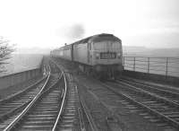 Brush Type 4 no 1108 opens up as it approaches Berwick on Tweed station off the Royal Border Bridge withthe 08.40 Leeds - Edinburgh in February 1970. This service bypassed Berwick but stopped at Dunbar.<br><br>[Bill Jamieson 21/02/1970]
