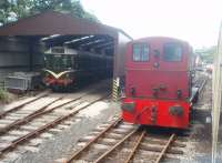 Part of the loco shed at Haverthwaite as seen from a train heading for Lakeside. The Class 03 shunter, D2117, was built at Swindon in 1959 and withdrawn from Springs Branch in 1971. It travelled to Ulverston under its own power and from there it went by road to Haverthwaite and has remained on the LHR ever since. The DMU is an ex Calder Valley BRCW Class 110 (without centre trailer), withdrawn from Neville Hill. <br><br>[Mark Bartlett 29/07/2010]