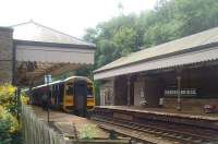 Hebden Bridge, as seen from the station forecourt looking east. 158849 is on a Calder valley line Manchester to Leeds service. <br><br>[Mark Bartlett 20/07/2010]