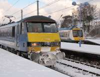 Freezing but still on time - the 0900 service to Liverpool Street awaiting its departure time at Norwich behind 90002 on an extremely cold winter's morning in January 2010.<br><br>[Ian Dinmore 07/01/2010]