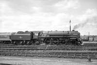 Britannia Pacific no 70038 <I>Robin Hood</I> stands in the yard at York on 2 July 1967 after bringing in the outward leg of a return steam railtour from Stockport via Standedge. The SLS tour, which had originated from Birmingham New Street, was electrically hauled between there and Stockport [see image 30112].<br>
<br><br>[Robin Barbour Collection (Courtesy Bruce McCartney) 02/07/1967]