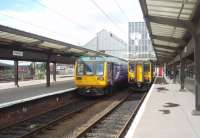 Unusual working arrangement at Preston on 4 August 2010. Instead of running from Blackpool South, the mid afternoon Colne service was cut back to start at Preston at 1520 and used bay platform 3C at the south end of the station. This pushed 153324 on the Ormskirk shuttle over into the rarely used 4C. In days gone by these bays were often used for stabling locomotives between turns but now only see units and only occasionally at that. <br><br>[Mark Bartlett 04/08/2010]