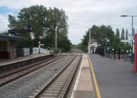 Lydney was originally known as Lydney Junction (for the Dean Forest Railway) and was built on a broad gauge railway as evidenced by the distance between the platforms. The Dean Forest preserved line terminus is close to the mainline station. This view, past the signalbox that still controls the level crossing, looks towards Chepstow.<br><br>[Mark Bartlett 12/06/2010]