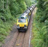 A coal train from Portbury import terminal, destination Rugeley power station, passing Ashton Gate on the western approach to Bristol on 4 August 2010. The locomotive is Freightliner class 70 no 70003.<br><br>[Peter Todd 04/08/2010]