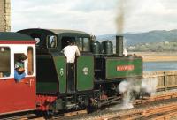 Narrow Gauge locomotive <I>Mountaineer</I> heads out onto <I>The Cob</I> as it leaves the Ffestiniog Railway's Porthmadog Terminus in the spring of 1988.<br><br>[David Pesterfield 26/03/1988]