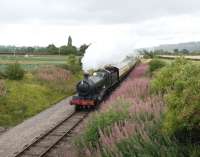 Ex-GWR Churchward 2-8-0 no 2807, seen heading towards Winchcombe in fine style on its inaugural run on 7 August 2010 [see image 30149]. Unfortunately, later in the day, an eccentric pin failed on the locomotive and ended up smashing a valve cover and ruining a set of piston valves, thus putting something of a damper on an otherwise enjoyable occasion.<br><br>[Peter Todd 07/08/2010]