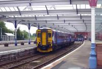 The 09.27 service to Glasgow Central (which starts the day as the 07.09 ex-Stranraer arriving via Ayr and reversing here) waits to leave Kilmarnock [see image 20116].<br><br>[Colin Miller /08/2010]