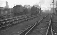 View west towards Central Glasgow at Parkhead MPD (65C) on 4 September 1960, with the buildings and chimneys of the Parkhead Forge in the background. Parkhead shed was officially closed by BR by the end of 1965 and demolished the following year.<br><br>[K A Gray 04/09/1960]