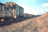 Scene east of Coldstream in 1969 showing D3638 with a contractor's train. Much of the tracklifting and recovery work on this line was undertaken by private organisations on behalf of BR [see image 26733]. The locomotive in question here, BR Class 10 no D3638, had previously been withdrawn but was subsequently reinstated and leased out to the firm concerned for this specific purpose.  <br><br>[Bruce McCartney //1969]