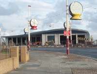 The new Blackpool tram depot at Starr Gate is making good progress and will be an impressive building, as seen here in this view looking south on the promenade road. It lies just to the seaward side of the turning circle and will house sixteen new Bombardier articulated tramcars.  The traditional fleet will continue to be maintained at Rigby Road Depot [See image 30259].<br><br>[Mark Bartlett 11/08/2010]