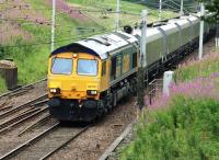 Northbound coal empties in the charge of GBRf 66701 pass Abington on 11 August 2010. Note that the facing crossover isbeing removed.<br><br>[Colin Miller 11/08/2010]