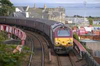 67030 with ECS off the 17.21 Edinburgh - Cardenden passing Burntisland Docks on 13 August.<br><br>[Bill Roberton 13/08/2010]