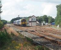 A late running afternoon S&C service for Leeds approaches Appleby from Carlisle passing the North signalbox with its junction for the link to the disused Warcop line. This semi-fast service was around 45 minutes down and so the Cumbrian Mountain Express, with 6201 <I>Princess Elizabeth,</I> had been allowed to run ahead of it including taking water at Appleby. <br><br>[Mark Bartlett 14/08/2010]