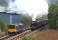 On 31 July 2010 ex-LMS Pacific no 6201 <I>Princesss Elzabeth</I> coasts along the straight at Buckshaw Village between Chorley and Euxton Junction with the <I>Cumbrian Mountain Express</I>. DMU 150146 on a Preston to Hazel Grove service is about to pass the special, which was running slightly early at this point and was being slowed down due a conflicting movement at Euxton Junction.<br>
<br><br>[John McIntyre 31/07/2010]