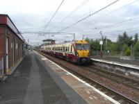 On 14 August unit 334 024 calls at Newton with a services for Motherwell.On the far right are the wires of the WCML, which also carries local services as far as Uddingston Junction. A connection exists allowing eastbound trains through Newton station to rejoin this line and vice-versa. It is shown on the ScotRail network map as 'Limited Service', but in the current passenger timetable this is limited to no service at all.<br><br>[David Panton 14/08/2010]