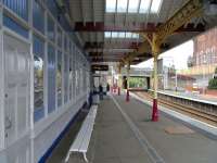 On 14 August the main station building at Coatbridge Sunnyside is caught in the middle of repainting with fresh FSR colours on the woodwork while the ironwork is still in SPT maroon and cream. The effect is almost that of a doctored image. (It isn't!)<br>
<br><br>[David Panton 14/08/2010]