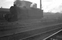 Evening at the west end of Parkhead shed in September 1960, with a Gresley V3 (thought to be 67616) standing in the shadows of the Parkhead Forge and the historic name <I>Beardmore</I> dominating the background. <br><br>[K A Gray 04/09/1960]