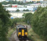 A Manchester Victoria to Clitheroe service in the hands of 150273 <br>
drifts downhill between Darwen and Blackburn near to the site of the former Hoddlesden Junction and Lower Darwen engine shed on 31 July 2010. <br>
<br><br>[John McIntyre 31/07/2010]